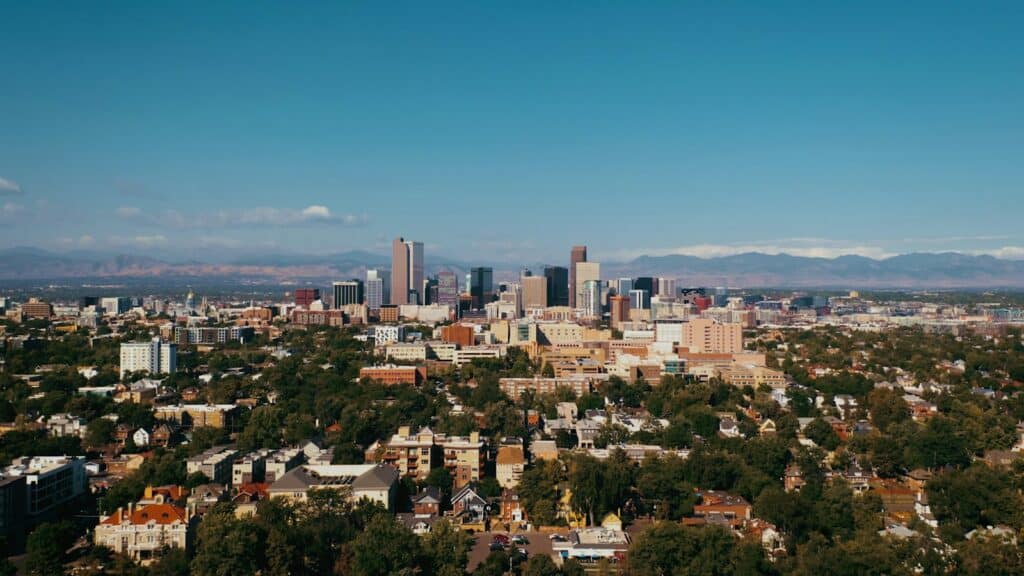 Denver city skyline with the Rocky Mountains in the background