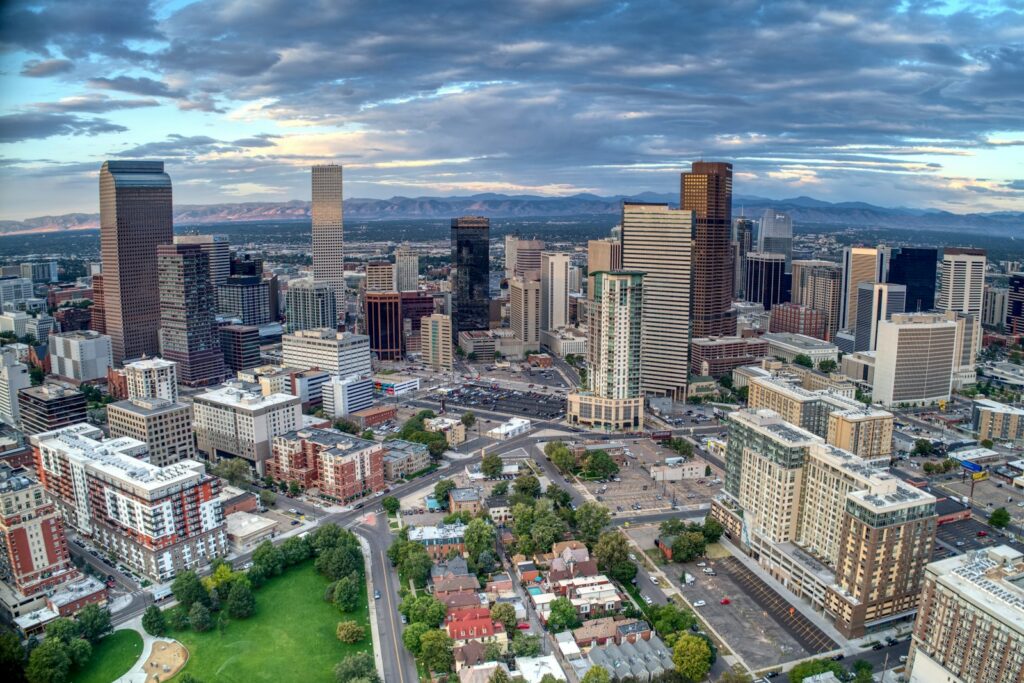 Aerial view of downtown Denver, Colorado with the Rocky Mountains in the distance