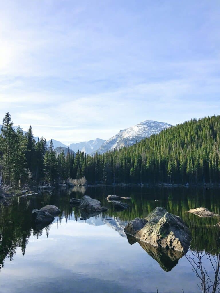 Mountain lake surrounded by evergreen forest near Evergreen, Colorado